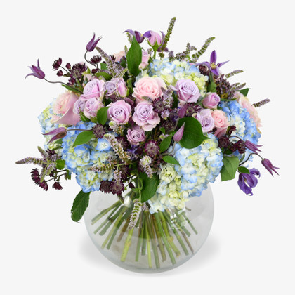 fluffy flowering mint and delicately hanging purple clematis