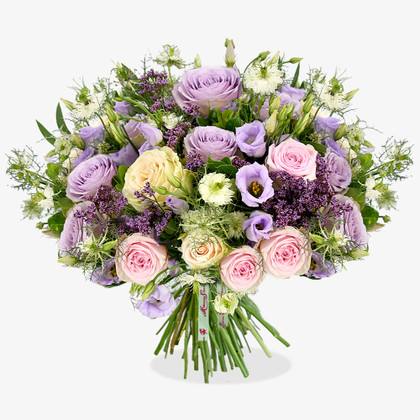 A magical, pastel palette encapsulates this charming design; with roses and lisianthus taking pride of place